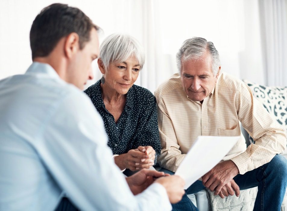 wealth advisor meeting with two clients